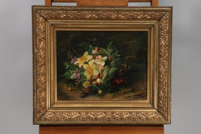 painting of a still life of flowers in a gold frame on a wooden easel