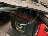 an image of a car being worked on by a mechanic