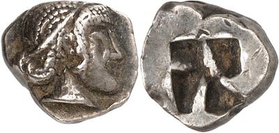 a silver coin with an image of a woman and a man on it