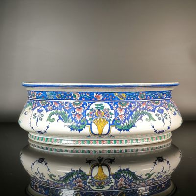 a blue and white bowl sitting on top of a table