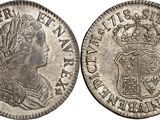 an old silver coin with a crown on it