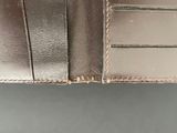 leather wallet with a card holder and two credit cards in it