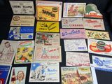 many different types of advertising cards laid out on a table