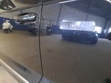 a car that is parked in a garage with a license plate on it