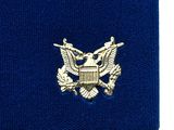 navy blue wristband with gold eagle emblem on it