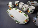 a lot of plates and cups on the table