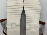 a close up of a pair of sandals on a white surface