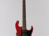 an electric guitar on a stand with a white background