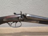 an old gun that is sitting on top of a table