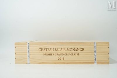 une boîte en bois sur laquelle est apposée une étiquette portant l'inscription « Château Belar - Monne »