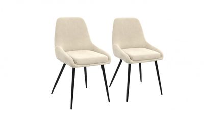 une paire de fauteuils couleur crème aux pieds noirs
