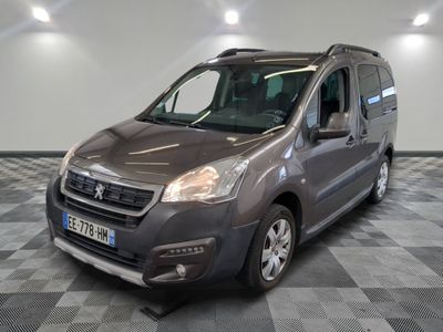 the grey van is parked on a checkered floor in the garage
