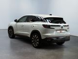 the rear view of a white suv parked in a white room