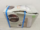 a box that has a coffee maker inside of it