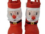 pair of red santa claus slippers on white background