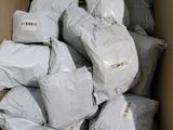 a large box full of bags of white stuff