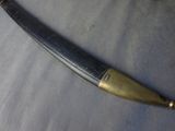 a knife that is laying on a blue cloth