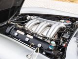 a close up of a car engine with the hood open