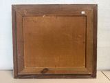 an old wooden picture frame with a small piece of wood in it