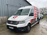a white van that is parked in front of a building