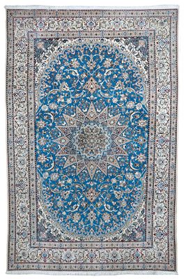 a blue rug with a medallion design on it