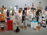 a lot of perfume bottles that are sitting on a table
