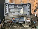 a tool box with tools on a workbench in a garage