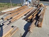 many pieces of wood that are sitting on the ground