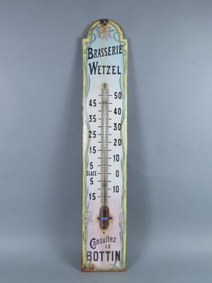 a close up of a thermometer on a gray background