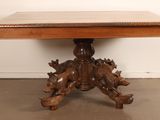 an image of a wooden table with carvings on top of it