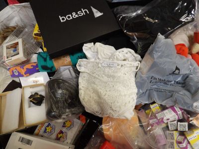 a pile of assorted items that are on a table