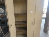 a cabinet that has a door open in a warehouse