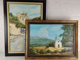 two paintings of a church and a country road are hanging on a wall