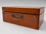 an old wooden box with a handle on a white background