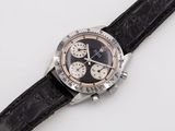 an image of a black and silver watch with a leather strap