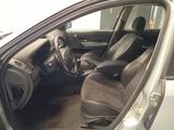 the interior of a car with the door open and the driver ' s seat up