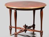 une table ronde avec deux pieds et un plateau en bois