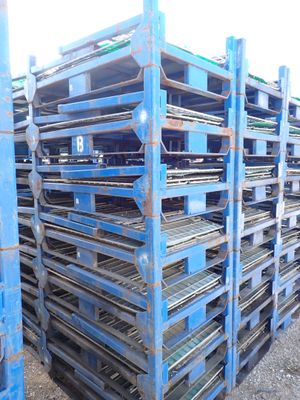 a large pile of pallets sitting on the ground