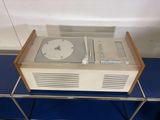 a record player sitting on top of a glass table