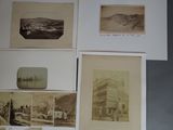 many old photographs of a town on the wall