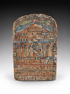 an egyptian painted stone plaque depicting a scene of a man and a woman