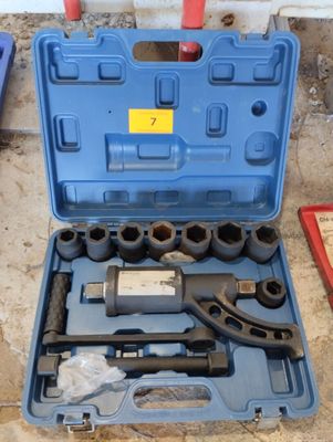 a blue tool case with tools in it on the floor