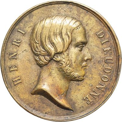 a close up of a coin with a man ' s face on it