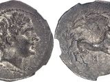 a close up of a coin with an image of a man on it