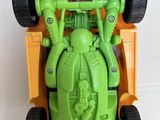 a toy car that is green and has two wheels on it