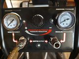 a close up of a pressurer with gauges on it