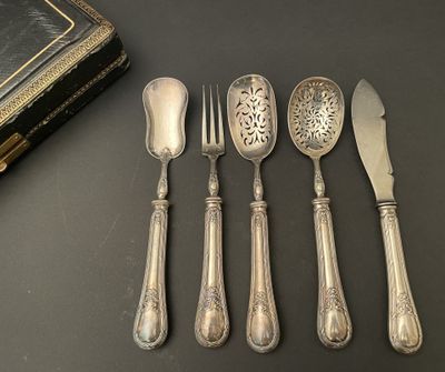 six antique silverwares and a book sit on a table