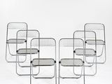 lot de quatre chaises en acier chromé avec assises tressées