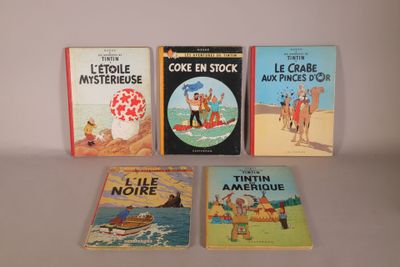 several books are lined up on a table with a white background