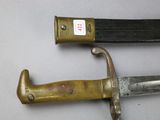 two knives that are laying next to each other on a table